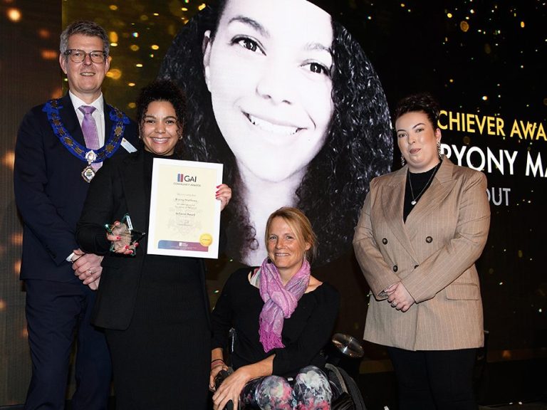 Image of Bryony receiving the Achiever Award in November 2023.